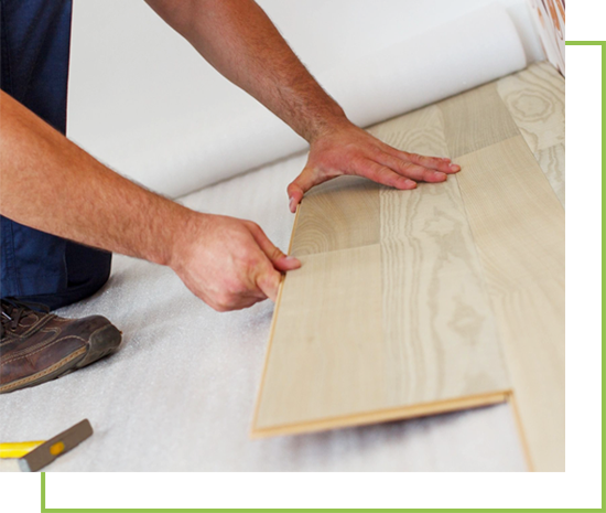 A person is working on the floor of their home.