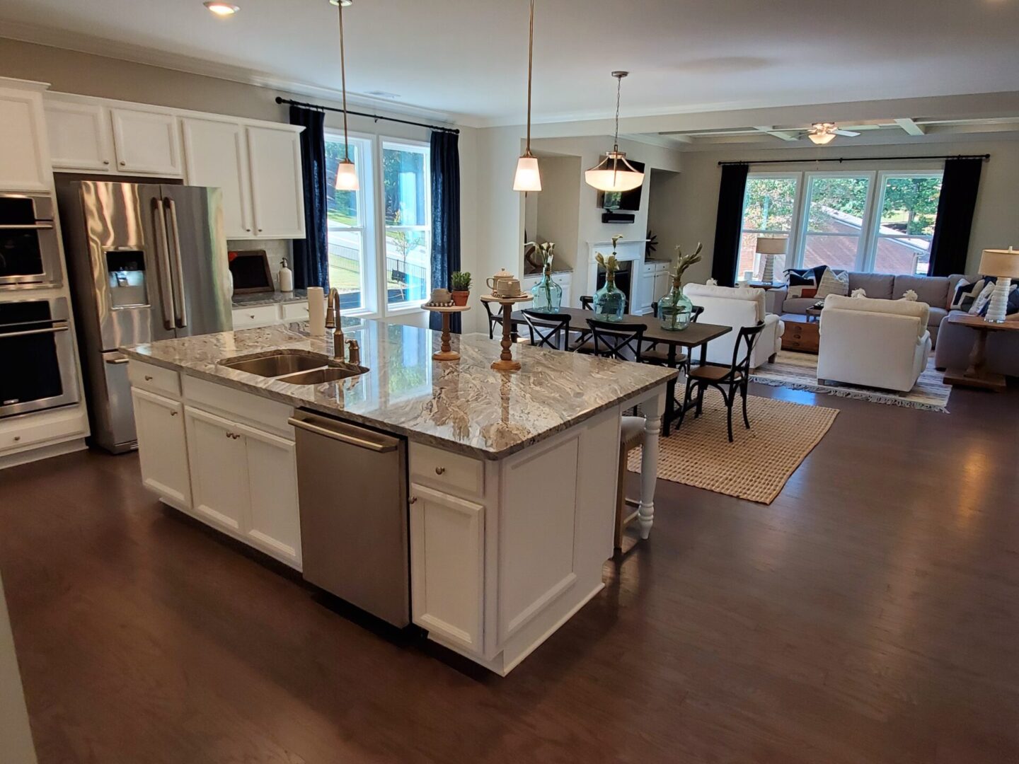Modern kitchen with island and living room view.
