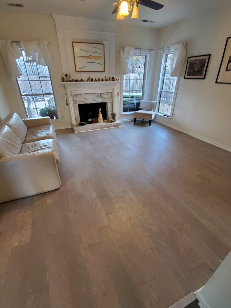 Light hardwood floors in a living room.