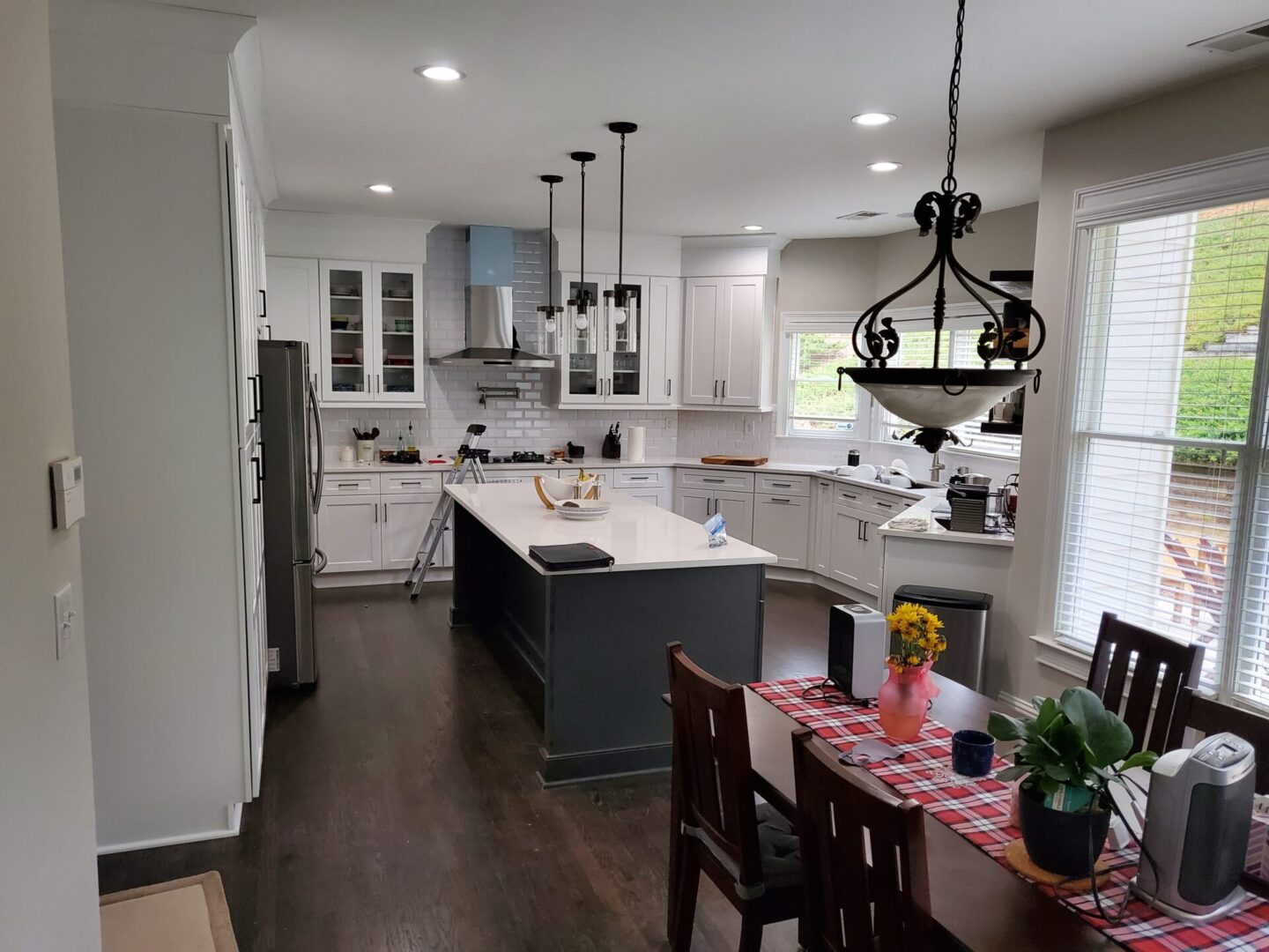 Modern kitchen with white cabinets and island.